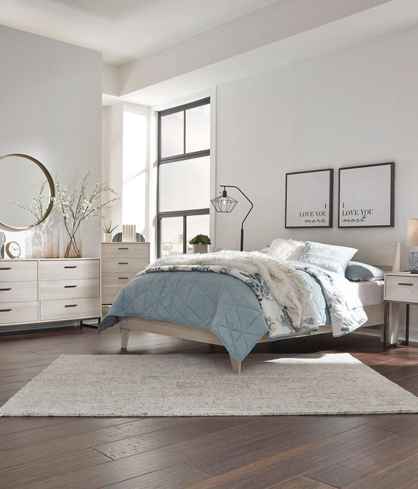Ashley Furniture Socalle Panel Bed with sleek wood finish and modern design, shown in a well-lit bedroom setting.