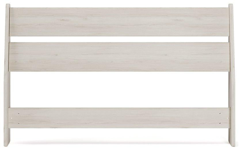Ashley Furniture Socalle Panel Bed with a sleek wooden frame and modern design, shown in a well-lit bedroom setting.