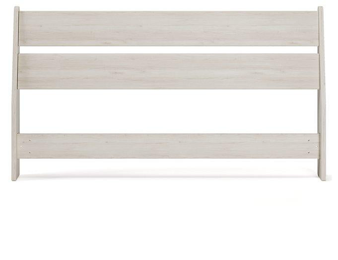 Ashley Furniture Socalle Panel Bed with a modern wooden frame and clean design, shown in a well-lit bedroom setting
