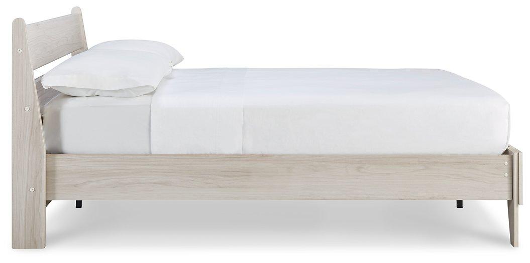 Ashley Furniture Socalle Panel Bed with a sleek wooden design and classic headboard, shown in a modern bedroom setting.