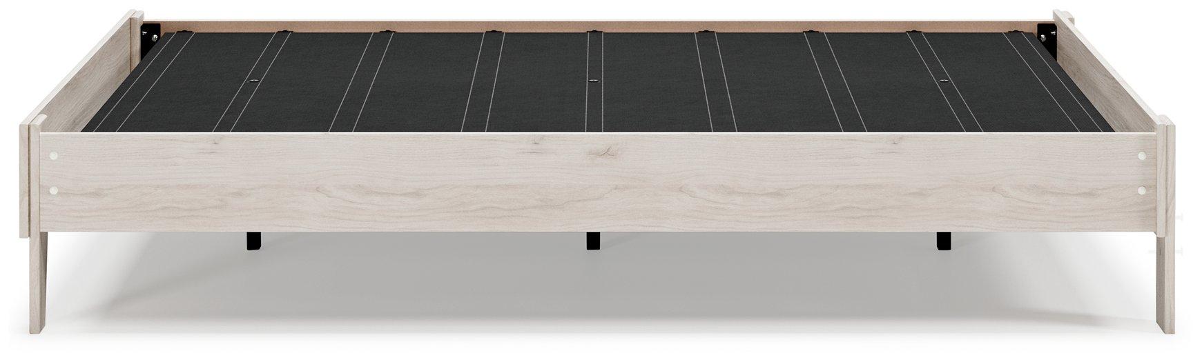 Ashley Furniture Socalle Panel Bed with a modern wooden design and clean lines, shown in a cozy bedroom setting.