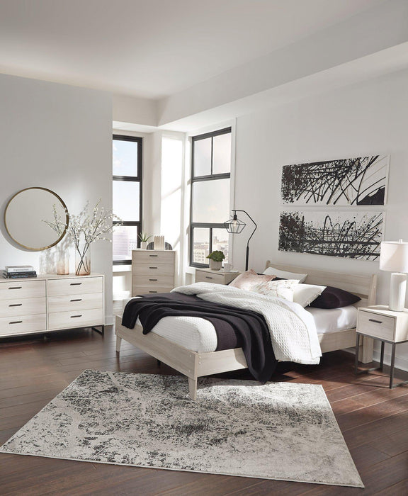 Ashley Furniture Socalle Panel Bed with a sleek, modern design featuring a sturdy wooden frame and a stylish headboard.