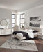 Ashley Furniture Socalle Panel Bed with a sleek, modern design featuring a sturdy wooden frame and a stylish headboard.