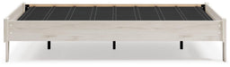 Ashley Furniture Socalle Panel Bed with a wooden frame and classic design, shown in a cozy bedroom setting.