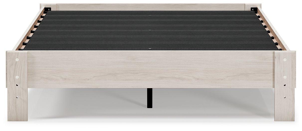 Ashley Furniture Socalle Panel Bed with a wooden frame and headboard, showcasing a modern design in a bedroom setting.
