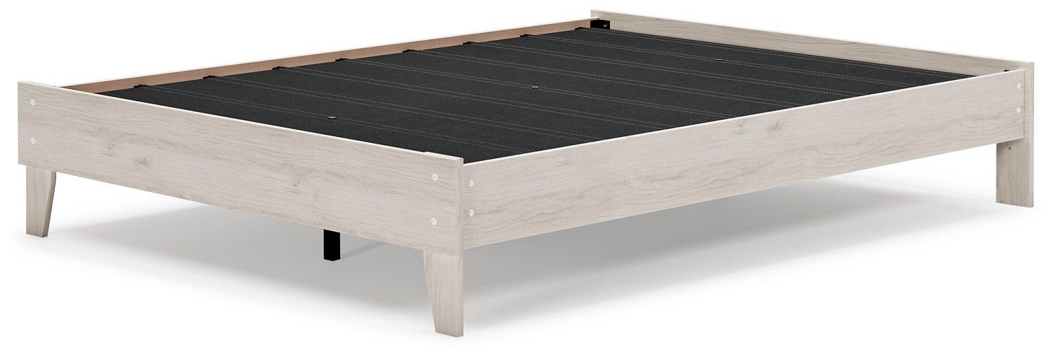 Ashley Furniture Socalle Panel Bed with a modern wooden design and clean lines, shown in a cozy bedroom setting.
