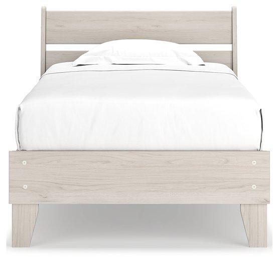 Ashley Furniture Socalle Panel Bed with a modern wooden frame and clean lines, shown in a spacious bedroom setting.