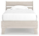 Ashley Furniture Socalle Panel Bed with a modern wooden frame and clean lines, shown in a spacious bedroom setting.