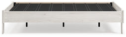 Ashley Furniture Socalle Panel Bed with a wooden frame and headboard, showcasing a modern bedroom design.
