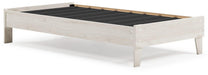 Ashley Furniture Socalle Panel Bed with a wooden frame and headboard, showcasing a modern bedroom design.