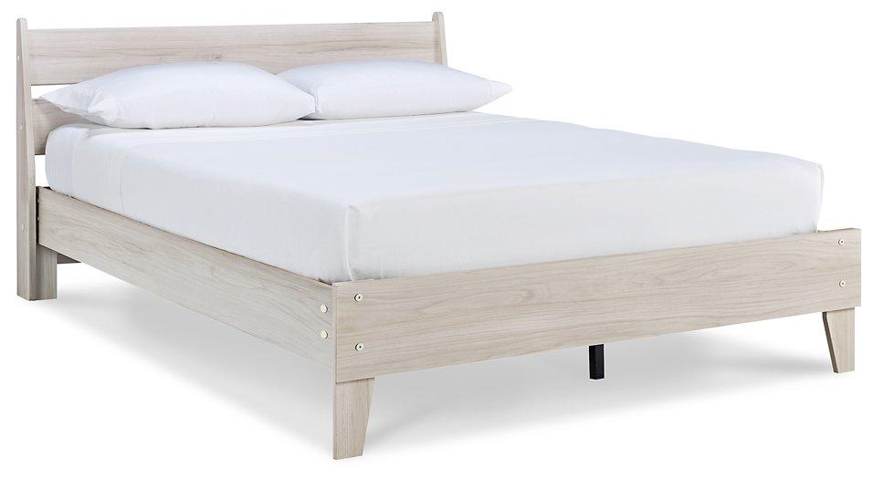 Ashley Furniture Socalle panel bed with a modern design, featuring a wooden frame and a sleek headboard in a natural finish.