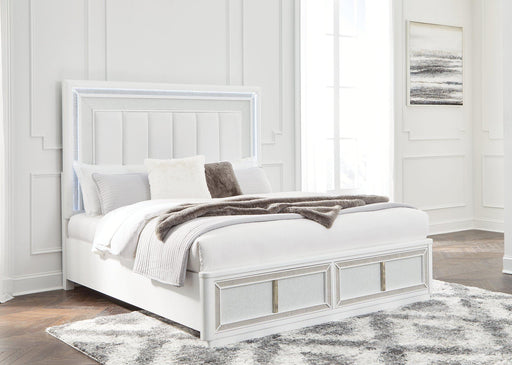 Ashley Furniture Chalanna upholstered storage bed with a padded headboard and built-in storage drawers in a modern bedroom setting.
