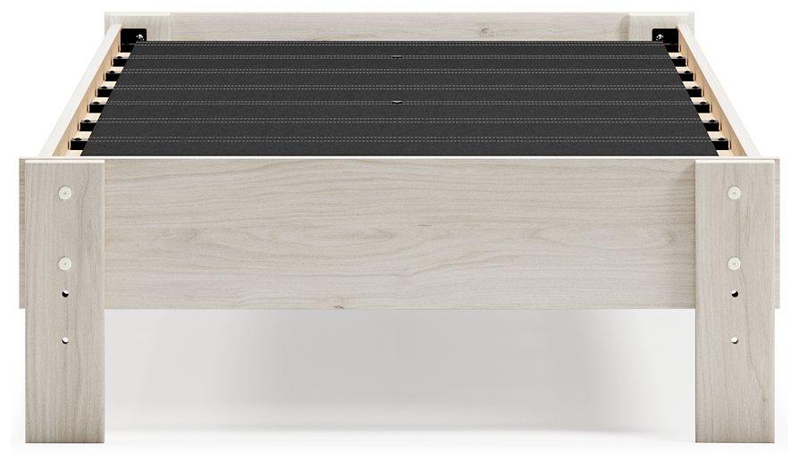 Ashley Furniture Socalle Panel Bed with a modern wooden frame and clean design, shown in a bedroom setting.