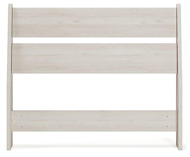 Ashley Furniture Socalle Panel Bed with a wooden frame and headboard, showcasing a modern design in a bedroom setting.
