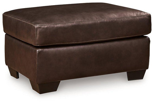 Ashley Furniture Santorine Ottoman with wooden legs and fabric upholstery, showcasing a stylish and versatile living room accent piece.