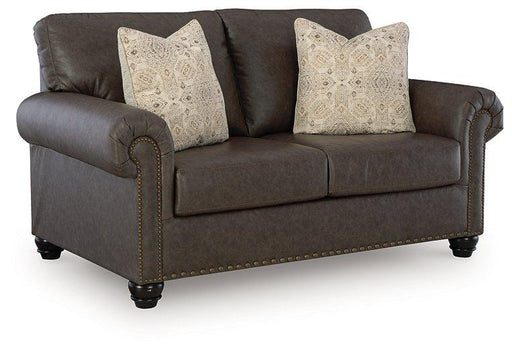 Ashley Roxmere loveseat with plush fabric and cushioned armrests, ideal for cozy living room seating.