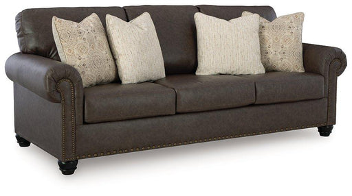 Ashley Furniture Roxmere Sofa with plush cushions and dark fabric upholstery, shown in a modern living room setting.
