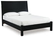 Ashley Furniture Danziar Bed with a stylish frame, shown from a side angle in a modern bedroom setting.
