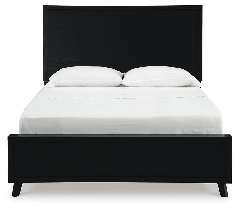 Ashley Furniture Danziar Bed with a dark wood finish and a upholstered headboard, shown from a front angle.