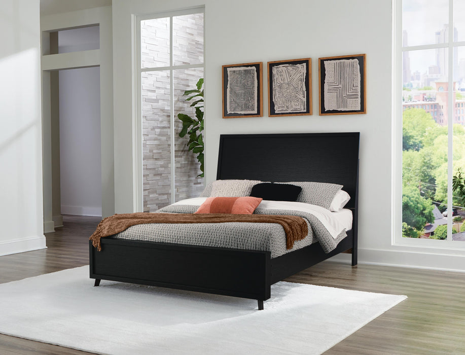 Ashley Furniture Danziar Bed with a sleek wooden frame and modern design, shown in a well-lit bedroom setting.