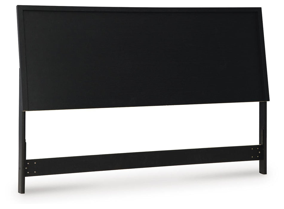 Ashley Furniture Danziar Bed with a stylish wooden frame and angled headboard, shown from a side angle.