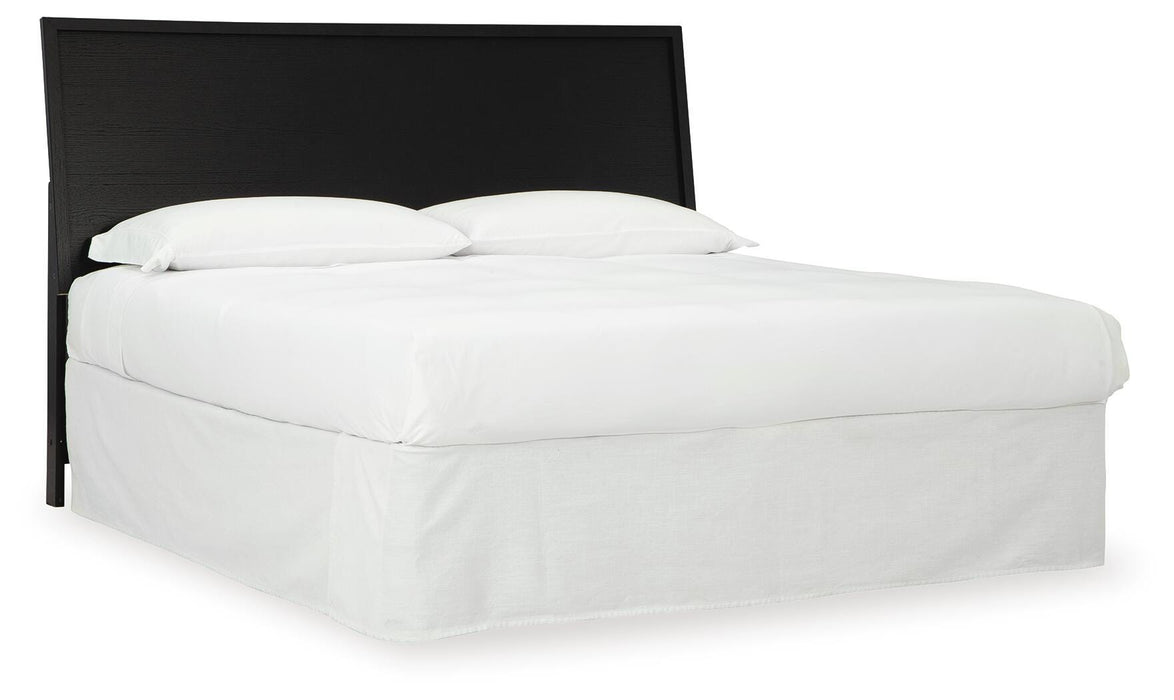 Ashley Furniture Danziar Bed in a stylish angle view, showcasing the wooden frame and elegant design features.