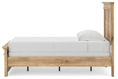 Ashley Furniture Makidern Bed with a modern design, showcasing a wooden frame and headboard in a bedroom setting.