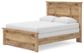 Ashley Furniture Makidern Bed with a stylish frame and neutral upholstery, shown from an angled side view.