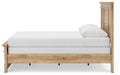 Ashley Furniture Makidern Bed in a neutral fabric with a sturdy wooden frame and a classic, stylish headboard design.