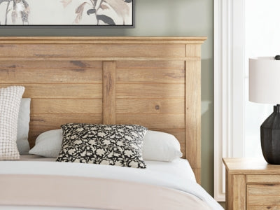 Ashley Furniture Makidern Bed with a detailed wood frame and elegant design, showcasing the headboard and craftsmanship.