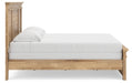 Ashley Furniture Makidern Bed with a modern frame, showcasing a sleek headboard and sturdy construction in a bedroom setting.