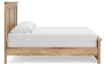 Ashley Furniture Makidern Bed with a modern frame, showcasing a sleek headboard and sturdy construction in a bedroom setting.