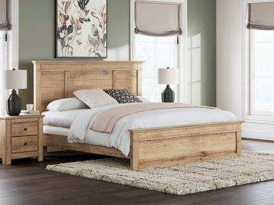 Ashley Furniture Makidern Bed with upholstered headboard and wooden frame, shown in a cozy bedroom setting
