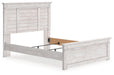 Ashley Furniture Makidern Bed with a sleek wooden frame and modern design, shown from an angled view.