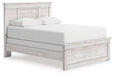 Ashley Furniture Makidern Bed with a sleek design, showcasing a sturdy frame and stylish headboard in a modern bedroom setting.