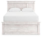 Ashley Furniture Makidern Bed with a sleek headboard and modern design, shown in a well-lit bedroom setting.