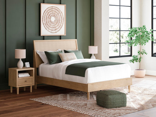 Ashley Furniture Cielden Bed with a wooden frame and upholstered headboard, shown in a stylish bedroom setting.