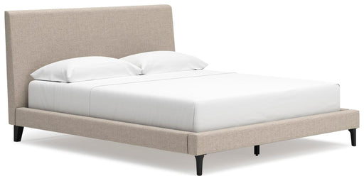 Ashley Furniture Cielden upholstered bed with roll slats, shown from an angled side view featuring a plush fabric headboard.