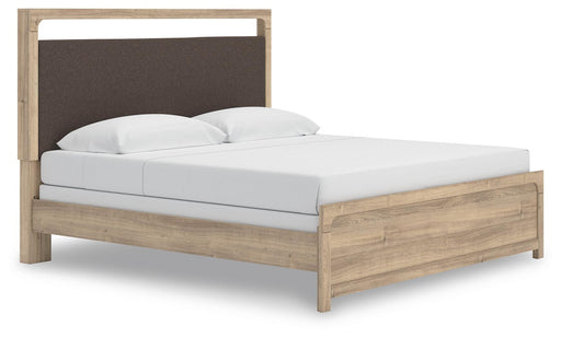 Ashley Furniture Kinlanni upholstered bed with plush fabric, tufted headboard, and modern design, shown from an angled side view.
