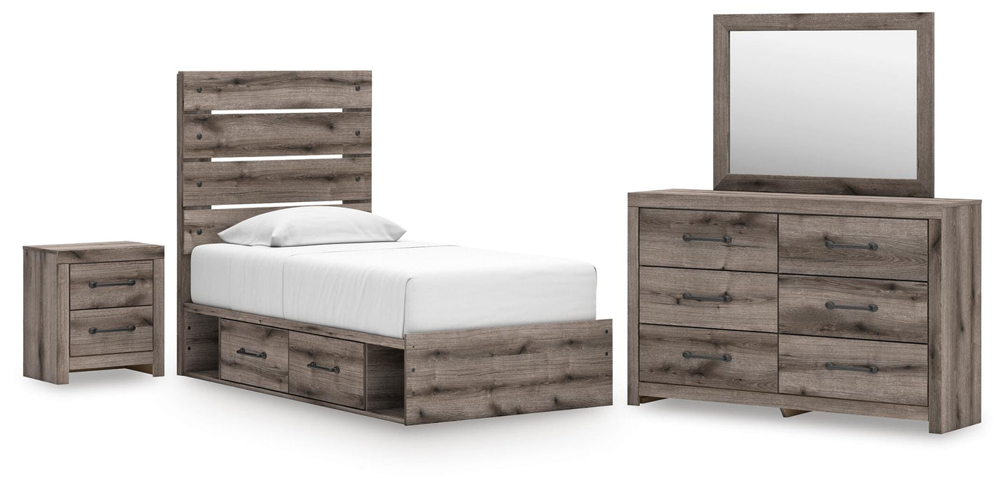 Graystorm bedroom set by Ashley Furniture featuring a bed, matching nightstands, and dresser in a modern gray finish.