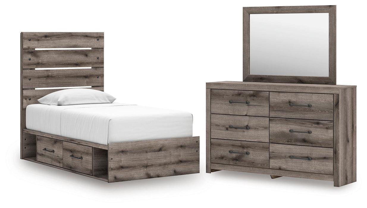 Graystorm bedroom set by Ashley Furniture featuring a bed, nightstands, and dresser in a modern gray finish