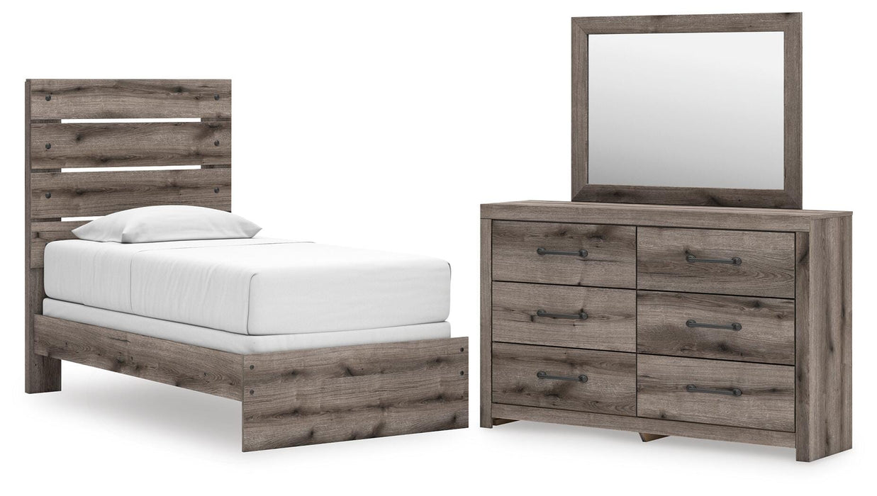 Graystorm bedroom set by Ashley Furniture featuring a modern bed frame, matching nightstands, and coordinated bedding.