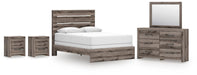 Graystorm bedroom set by Ashley Furniture featuring a bed, nightstands, and dresser in a modern gray finish.