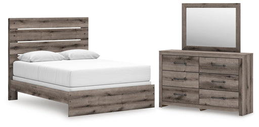 Graystorm bedroom set by Ashley Furniture, featuring a modern bed frame, matching nightstands, and coordinated bedroom furniture.