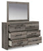 Graystorm bedroom set by Ashley Furniture, featuring a modern bed frame, matching nightstands, and dresser in a cozy gray finish.