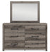 Graystorm bedroom set by Ashley Furniture, featuring a modern bed frame and matching nightstands with a sleek gray finish.