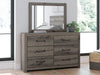Graystorm bedroom set by Ashley Furniture featuring a modern bed frame, matching nightstands, and dresser in gray finish.