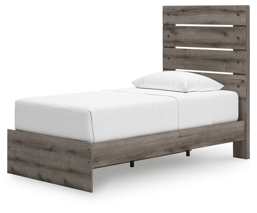 Graystorm bedroom set by Ashley Furniture, featuring a bed frame, dresser, and nightstands, shown from an angled view.