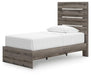 Graystorm bedroom set by Ashley Furniture, featuring a bed frame, dresser, and nightstands, shown from an angled view.