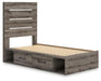 Gray Ashley Furniture Bedroom Set with bed, nightstands, and dresser, shown from an angled view in a modern bedroom setting.